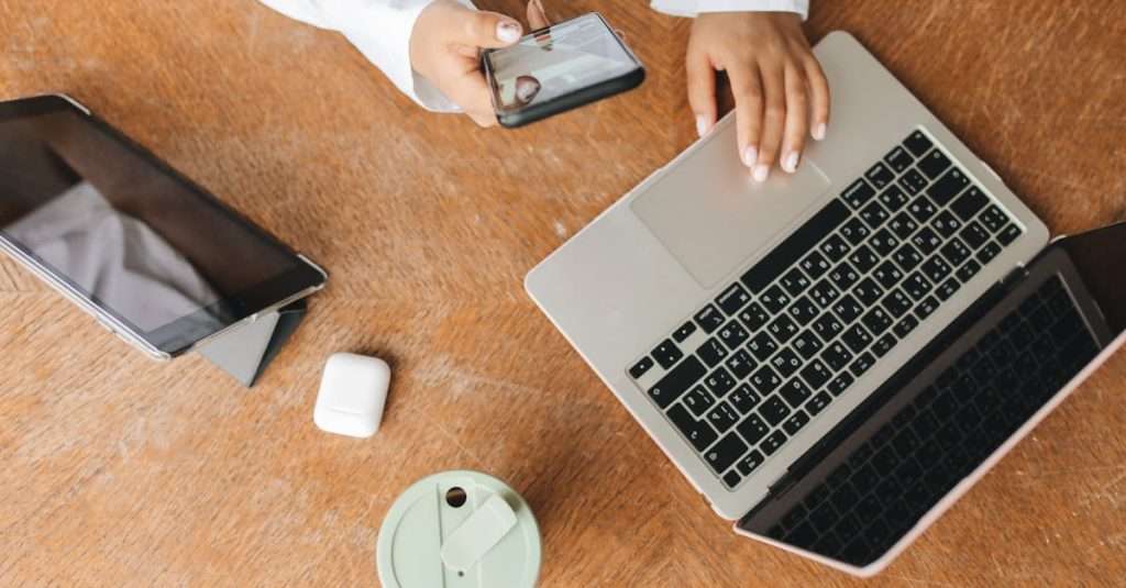Person in White Dress Shirt Using Laptop